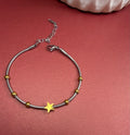 Pulsera estrella doble tono