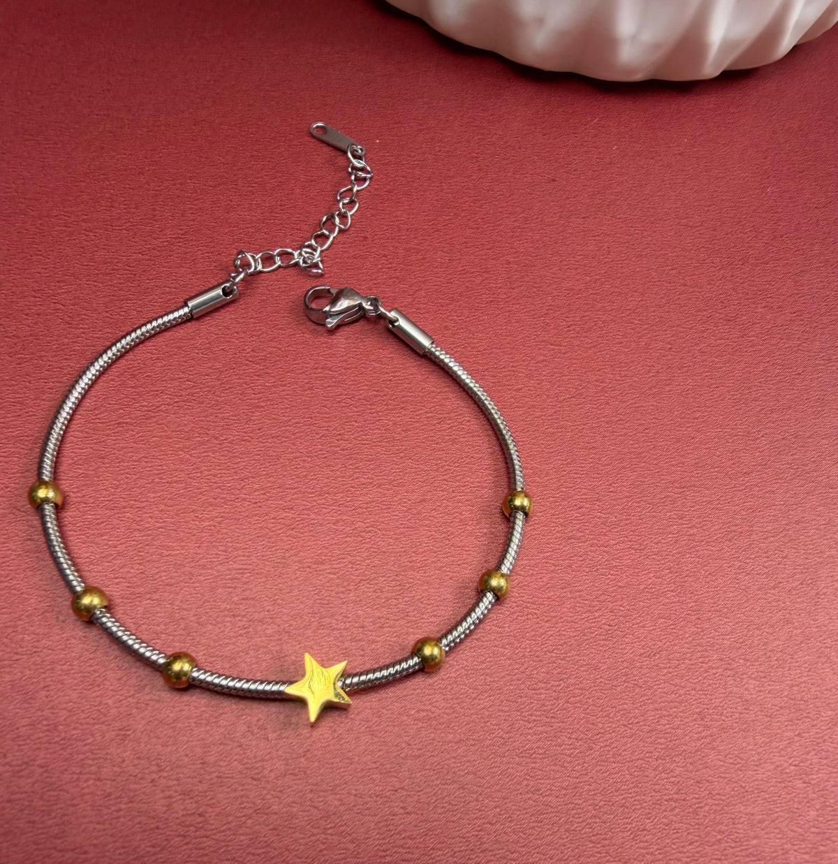 Pulsera estrella doble tono