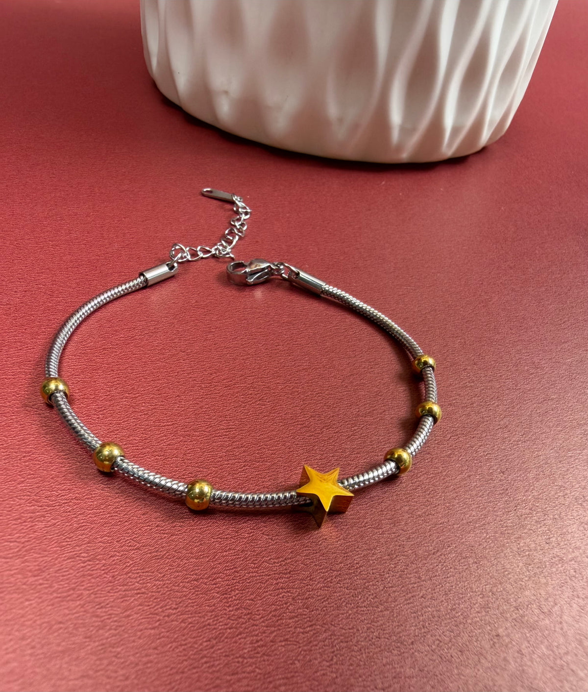 Pulsera estrella doble tono