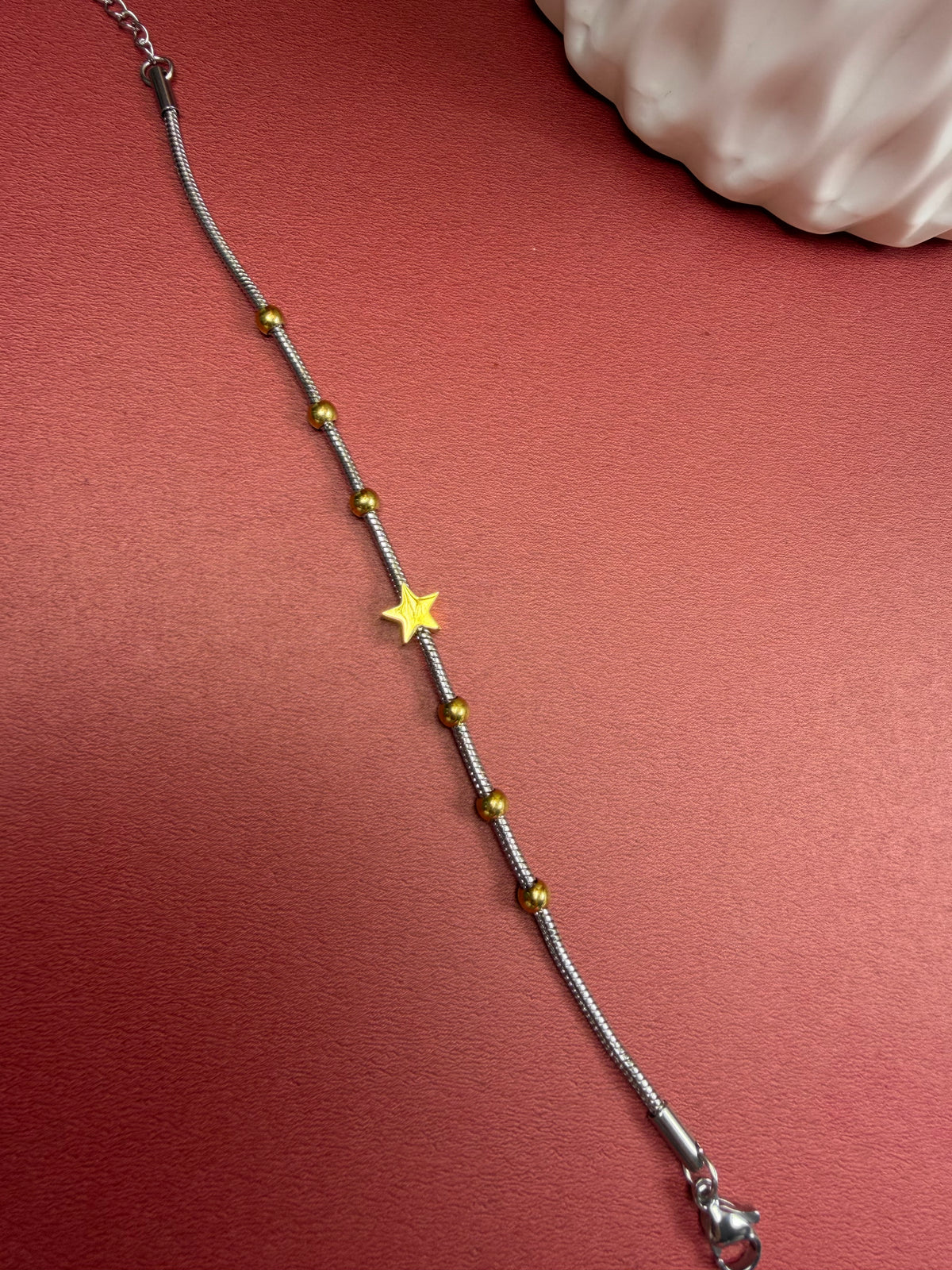 Pulsera estrella doble tono